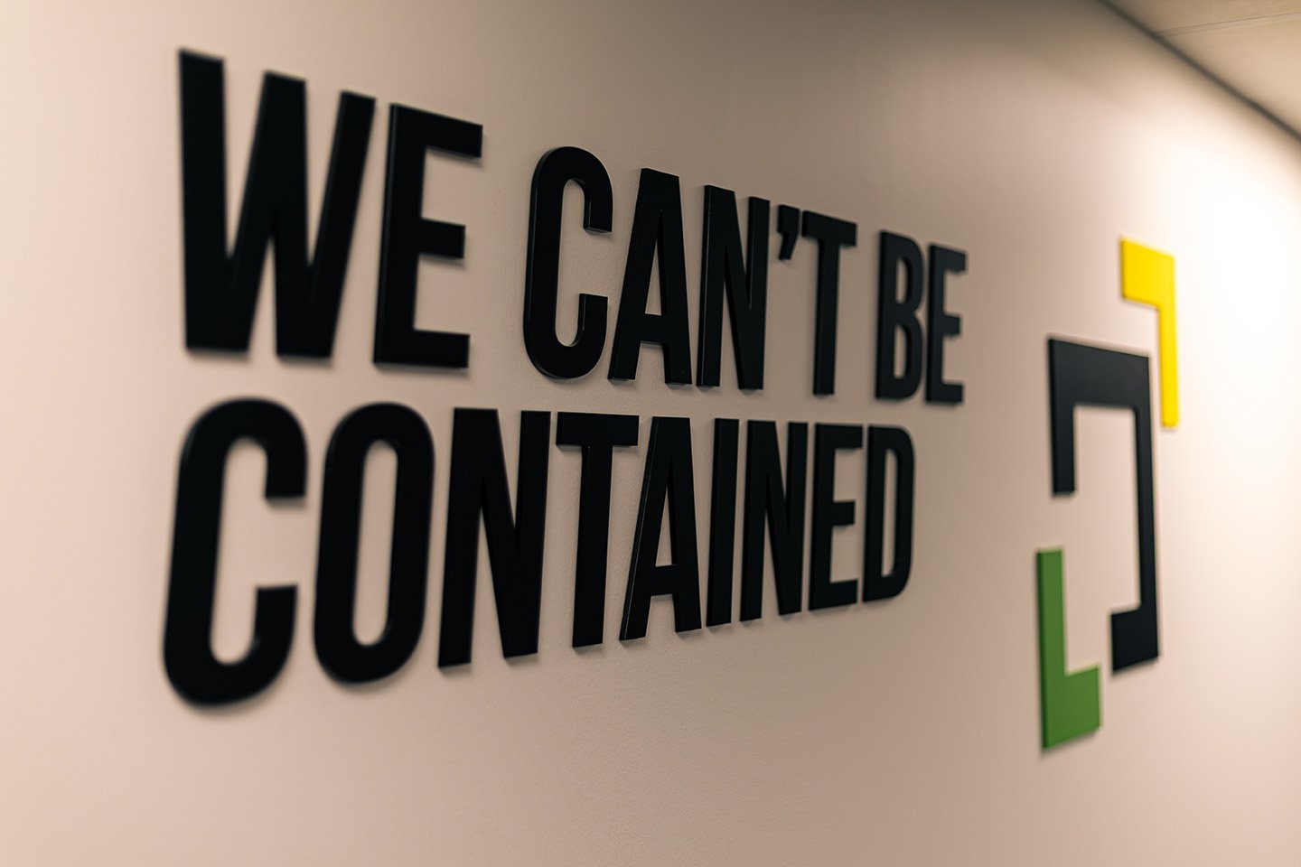 Image showing a banner 'We can't be contained' with Source Logistics logo